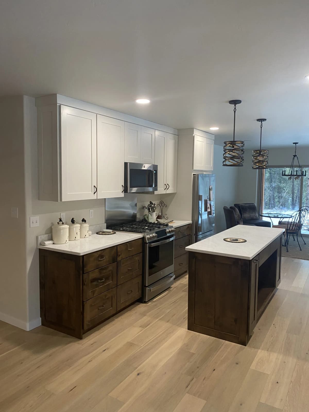 Custom knotty alder kitchen cabinetry crafted by Two Rivers Cabinetry in Comal County Texas